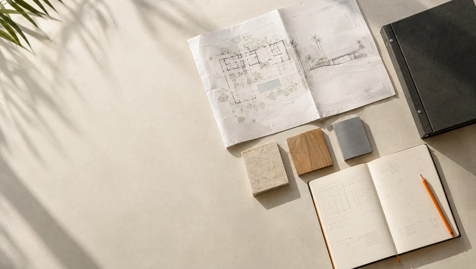 Concept photograph of an organized project binder, drawings, notebook and material samples